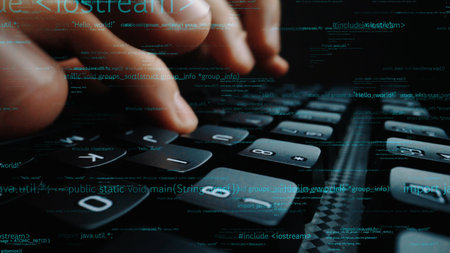 A close-up image shows hands rapidly typing on a computer keyboard, overlaid with lines of code,...