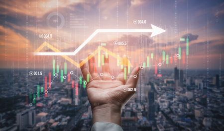 A hand supports a rising graph symbolizing financial growth against a stunning city skyline at...