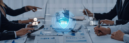 A modern business meeting showcasing cybersecurity discussions, with VPN visualizations and data protection elements present in a sleek office environment.の写真素材