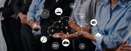 Diverse business professionals engage with cloud technology, showcasing digital icons that represent...