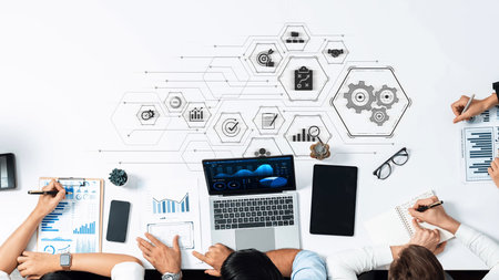A dynamic workspace featuring a business team engaged in data analysis and strategic discussions,...