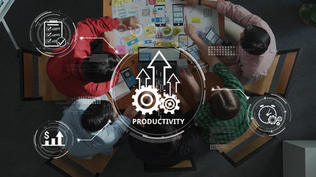 A dynamic overhead view of a collaborative workspace where team members engage in productive brainstorming and strategic planning using visual tools for improved results. Rasterの写真素材