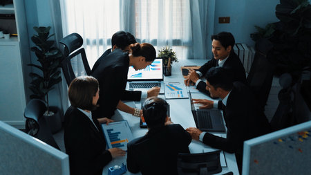 Top view of diverse business people brainstorm marketing idea while marketing team analyst stock market investment. Group of skilled project manager solving problems and sharing plan. Directorate.の写真素材