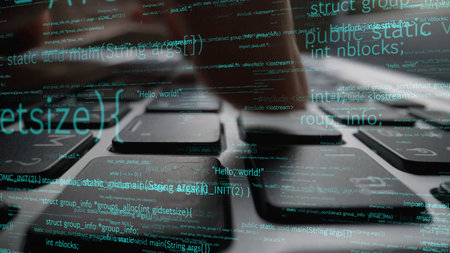 This image captures a close-up of a computer keyboard with programming code displayed, emphasizing...