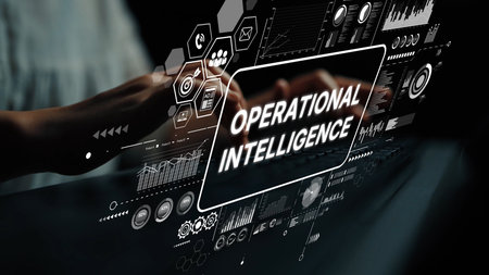 Hands Typing on Keyboard with Operational Intelligence Data Visualization and Technology Elements in...
