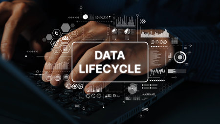 Hands Typing on Keyboard with Overlay of Data Lifecycle Concept Graphics and Analytics Background. Asymptotic smart data analytic.の写真素材