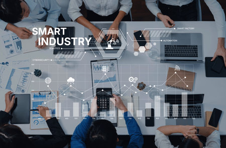 A modern business team collaborates over digital tools and data presentations in a smart industry setting, fostering innovation and effective decision-making.の写真素材