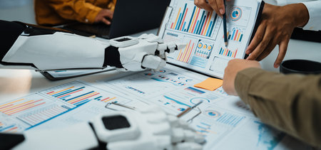 A dynamic meeting scene featuring human and robotic hands collaborating over detailed business...
