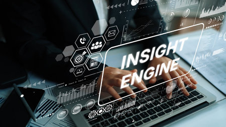 Hands Typing on Laptop with Digital Graphics for Insight Engine Technology Concept in Modern Office....