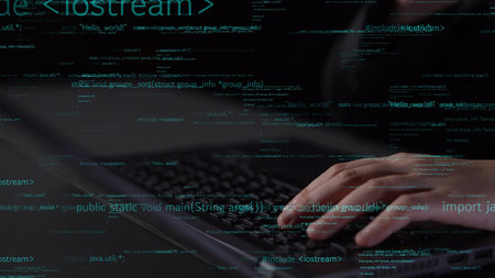 Close-up of hands typing on a keyboard with digital programming code overlay. Perfect for visuals in technology, coding, and innovation themes in dark environments.の写真素材