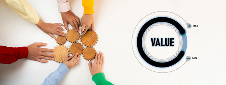 Hands join together to arrange wooden cogs while a graphic illustrates the value scale, symbolizing teamwork, collaboration, and the journey toward optimal business efficiency.の写真素材