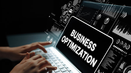 Business Optimization Strategies Displayed on a Modern Laptop with Digital Graphs and Data Visualizations in a Dark Setting. Asymptotic smart data analytic.の写真素材