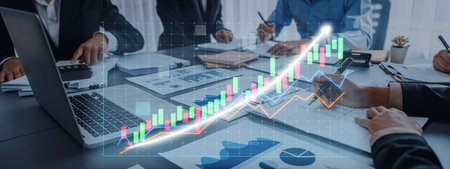 Professionals engage in a business meeting, analyzing charts and graphs that reflect financial...