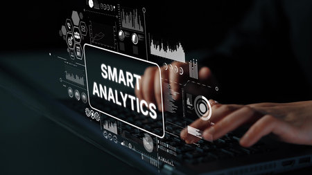 Hands Typing on Laptop with Smart Analytics Interface and Data Visualization Elements in Dark Setting. Asymptotic smart data analytic.の写真素材