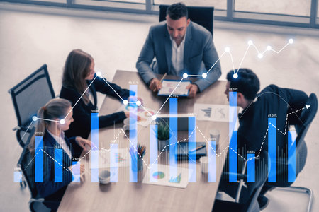 Professionals engage in a collaborative business meeting, analyzing growth data through graphs, charts, and visual representations in a modern office environment.の写真素材