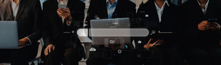 A group of business professionals engages with laptops and smartphones in a modern office setting, featuring a digital search interface that symbolizes innovation and connectivity.の写真素材