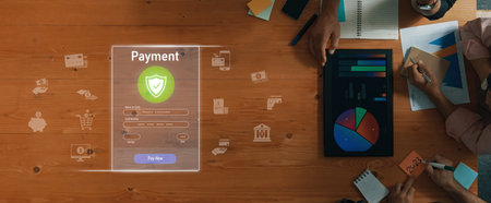 A detailed view of a secure online payment interface displaying user inputs atop a wooden desk filled with business tools, charts, and financial graphics.の写真素材