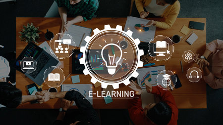 A diverse group of individuals collaborates at a modern workspace, engaged in e-learning activities....