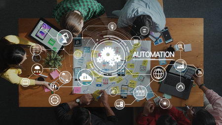 A diverse team collaborates around a wooden table, discussing automation strategies using digital...