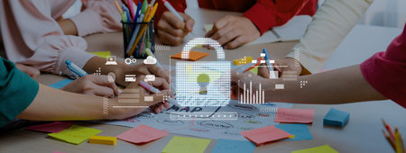 A dynamic business meeting scene showcasing hands engaged in collaboration and strategic planning...