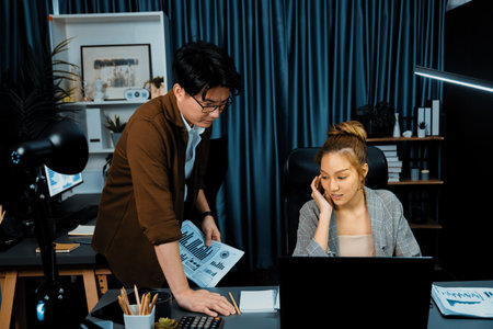 Serious face thinking businesswoman focusing computer to report database analysis online with...
