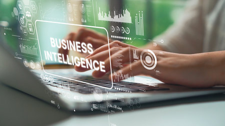 Hands Typing on Laptop with Data Visualization and Business Intelligence Graphics Overlay Concept. Asymptotic smart data analytic.の写真素材