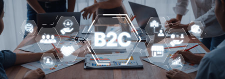 A dynamic meeting focused on developing business to consumer strategies, showcasing collaboration through visual elements of digital marketing and communication tools.の写真素材