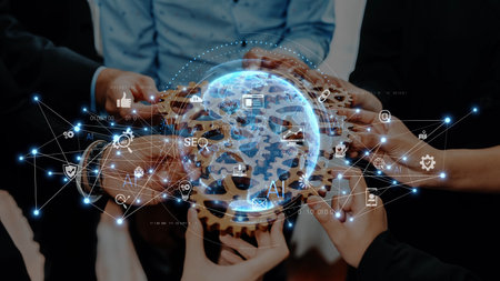 A diverse group of professionals engaging in teamwork while surrounded by digital icons showcasing innovation, technology, and global connectivity in a modern environment. Rasterの写真素材