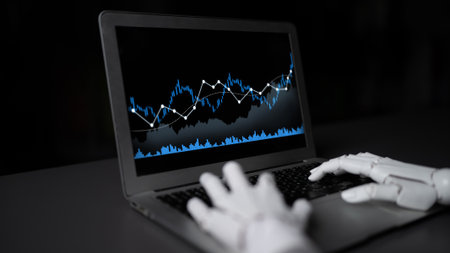 A robotic hand interacts with a laptop displaying financial data, featuring blue graphs and charts...