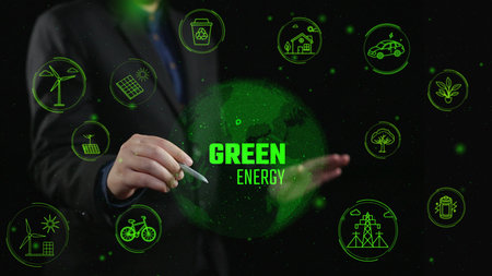 A businessman highlights the importance of green energy through a digital interface displaying icons of renewable resources and eco-friendly innovations, promoting a sustainable future.の写真素材