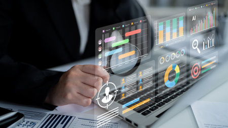 Business professional analyzes various data visualizations on a laptop, focusing on AI insights and...
