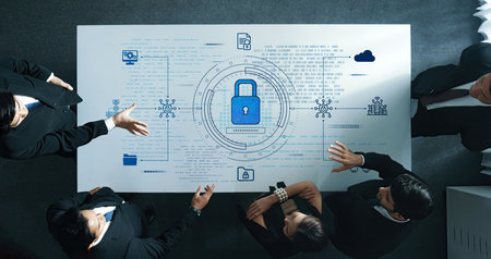 A diverse group of professionals works together at a table, discussing a cybersecurity strategy...