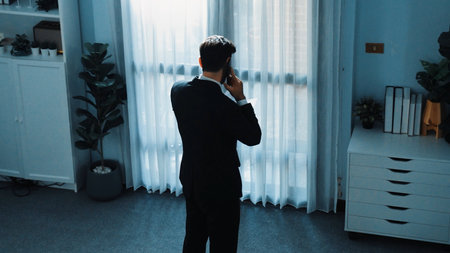 Top view of smart male leader calling phone while project manager give financial document. Businessman talking to investor to brainstorm idea by phone while looking at data analysis. Directorate.の写真素材