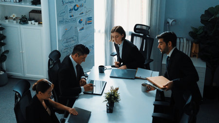 Business people sitting at seat and prepare for meeting at whiteboard with colorful sticky notes and mind map. Professional diverse group talking about marketing plan at meeting room. Directorate.の写真素材
