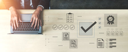 A top view of hands typing on a laptop in a modern workspace, surrounded by icons representing documentation and workflow efficiency, symbolizing professional productivity.の写真素材