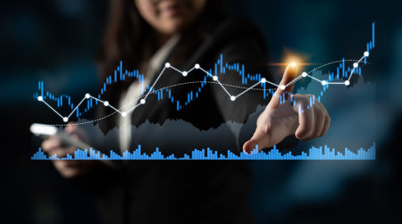 A businesswoman interacts with a digital financial chart, analyzing data in a modern office. This...