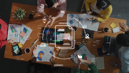 A diverse group of professionals collaboratively discusses business strategies while analyzing data...