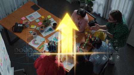 A dynamic office scene showcases a diverse team engaged in strategic planning and data analysis. The...
