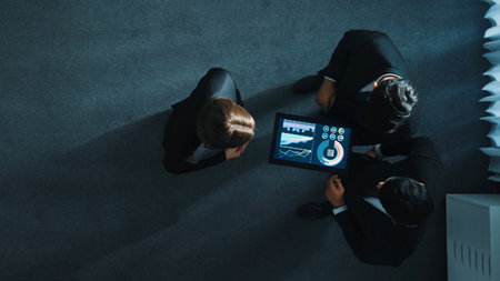 Top view of smart manager shaking hand with diverse team and analyze financial data from tablet. Time lapse of leader joining the group making a deal and sharing marketing strategy. Directorate.の写真素材