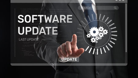 A businessman interacts with a digital interface to initiate a software update, illustrating modern technology role in business operations and efficiency improvement.の写真素材