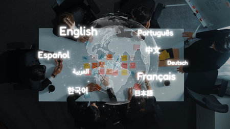 Aerial view of a diverse group engaged in a business meeting, showcasing various languages displayed on a world map, symbolizing global collaboration and communication. Rasterの写真素材