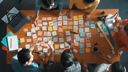 Top view of smart project manager talking and explain idea and clapping idea. Aerial view of business people applause to successful project. Aerial view of team clap hands at meeting room. Symposium.の写真素材