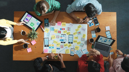 Time lapse of developer team sharing idea of Ux Ui design by using mind map. Top down view of group...