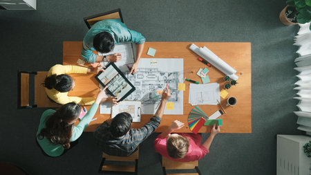 Time lapse of professional engineer looking at blueprint at meeting room. Top view architect team...