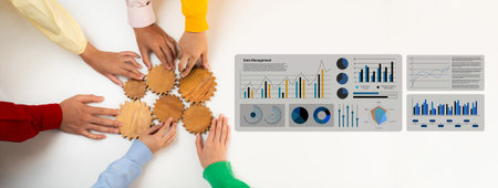 Hands of diverse individuals assembling wooden gears iconizing teamwork, complemented by data charts...