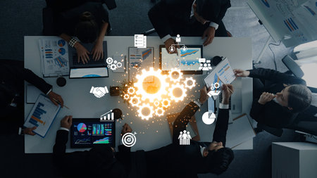 A diverse team gathers around a conference table, collaborating on digital analytics and strategic...