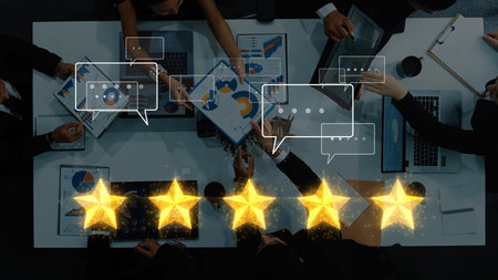 A group of professionals engages in a strategic meeting surrounded by charts and data visuals, emphasizing teamwork and communication with a five-star rating effect. Rasterの写真素材