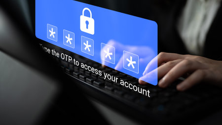A focused user inputs a one-time password on a keyboard, emphasizing the importance of security and privacy in online account access during digital transactions. Gantryの写真素材