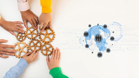 Hands of diverse individuals collaboratively arrange gears, symbolizing teamwork and innovation in a global business context, showcasing the importance of unity. Rasterの写真素材