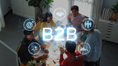 A diverse team engages in a collaborative B2B meeting, developing strategies and tracking progress...